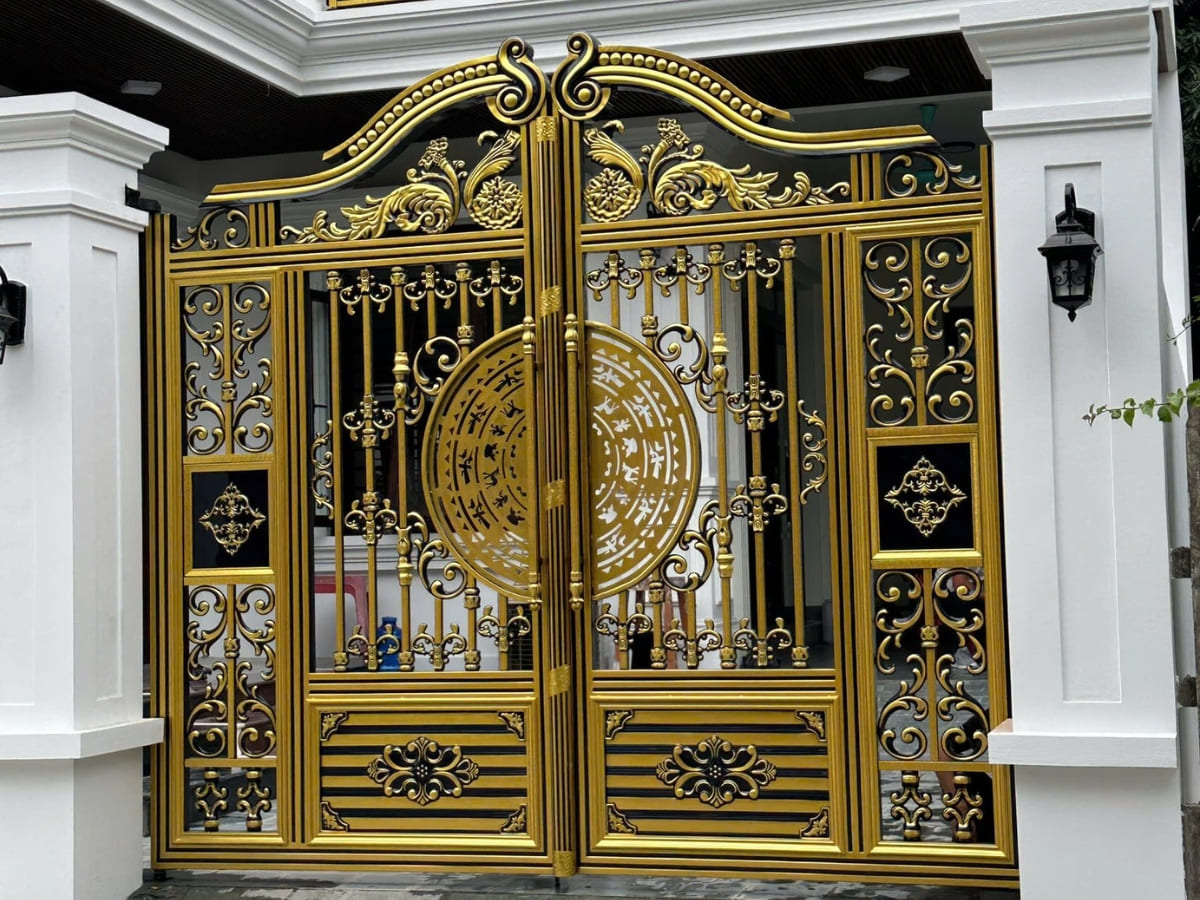 Cổng inox sơn nung họa tiết trống đồng